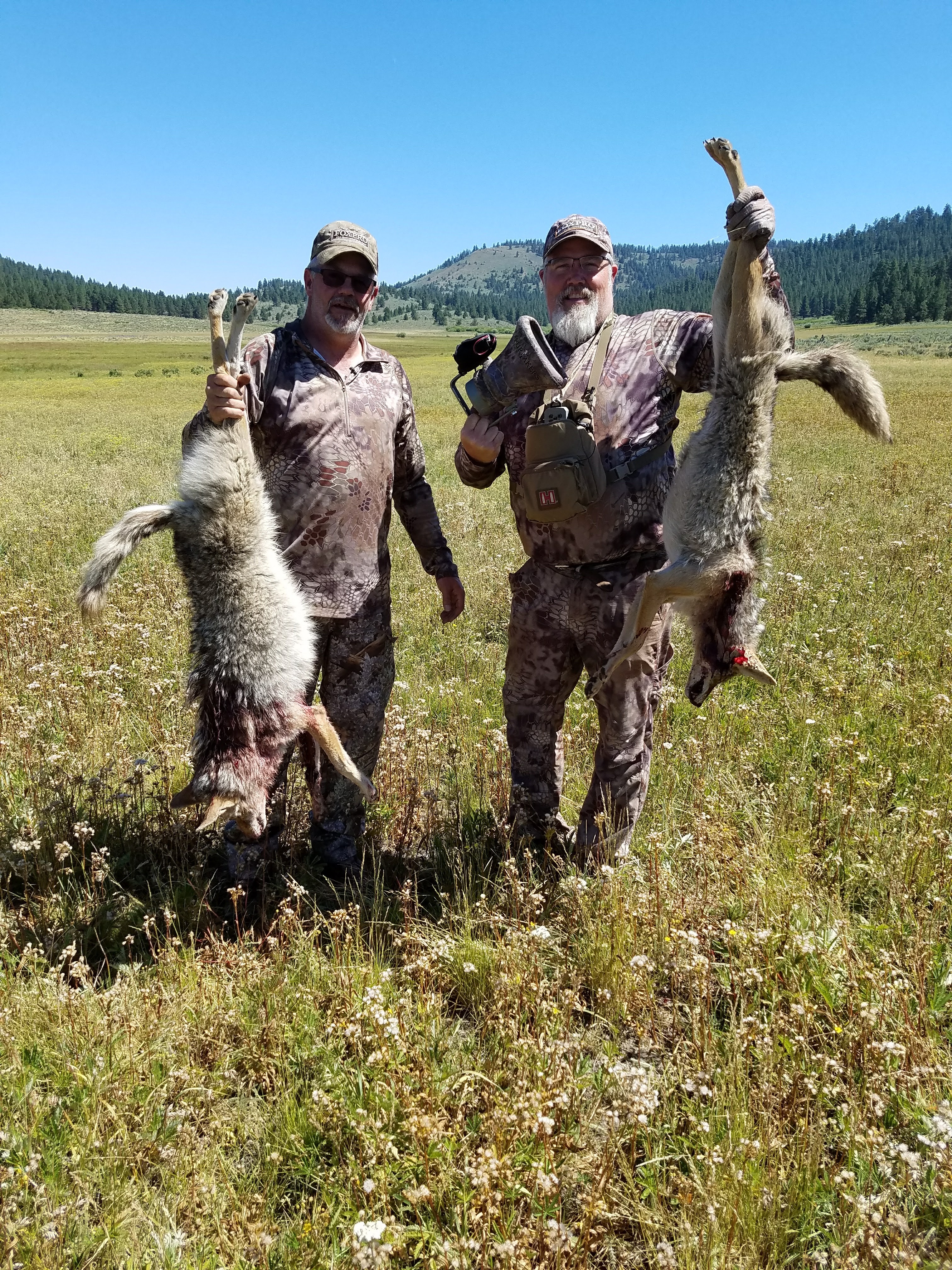 Al Morris Standing with a harvested coyote